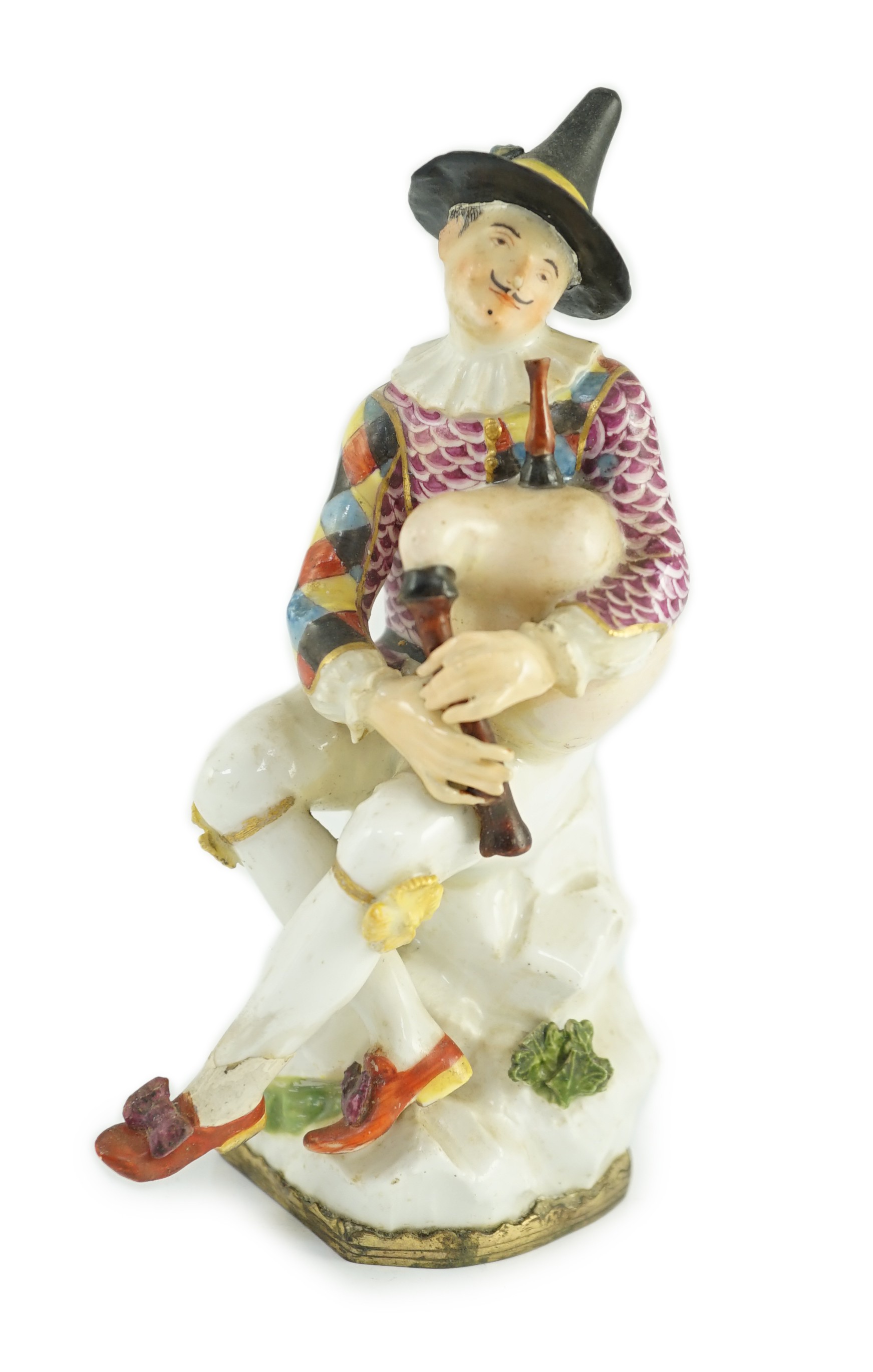 A Meissen porcelain figure of a seated bagpiper, mid 18th century, modelled by J.J. Kandler, 15cm high, restored, Provenance - purchased from Winifred Williams, Eastbourne/London before 1970.